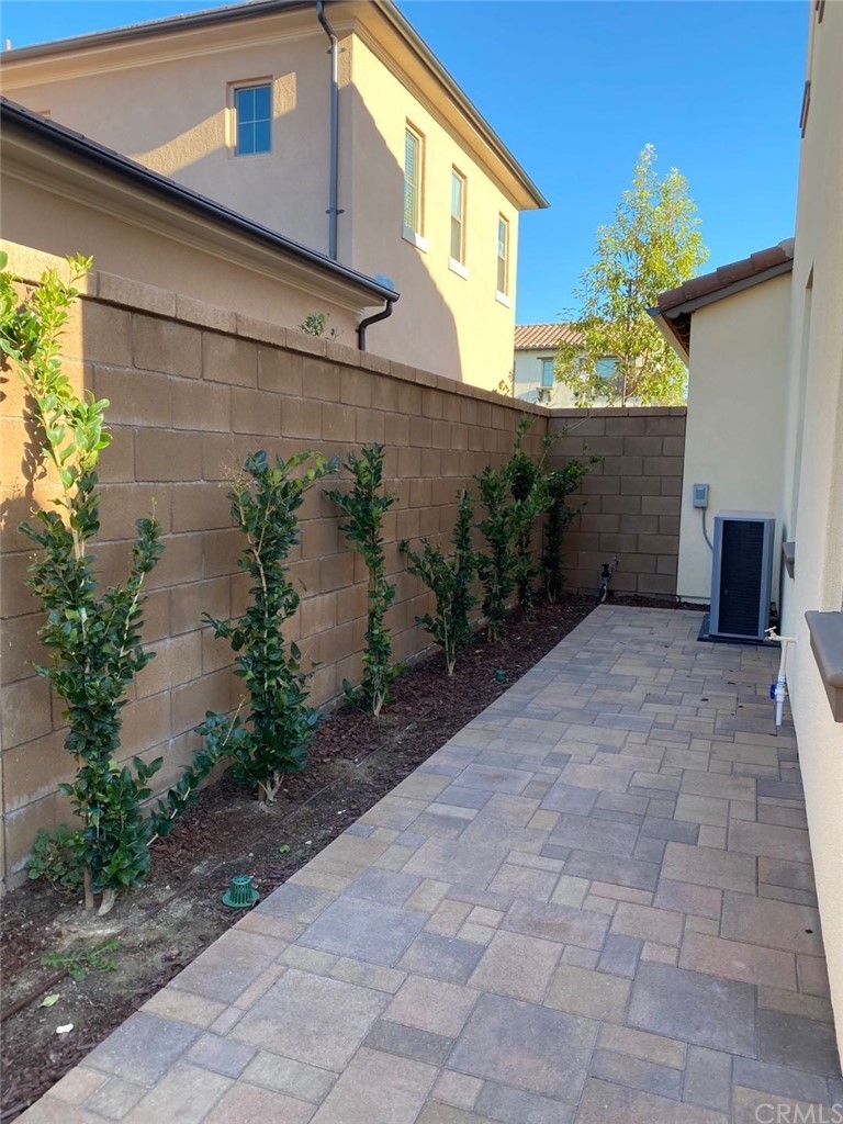 63 Singer Irvine, CA 92620 - Photo 29 of 33 a view of a house with a yard and potted plants