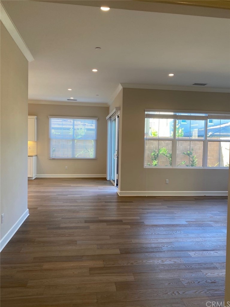 63 Singer Irvine, CA 92620 - Photo 5 of 33 an empty room with wooden floor and windows
