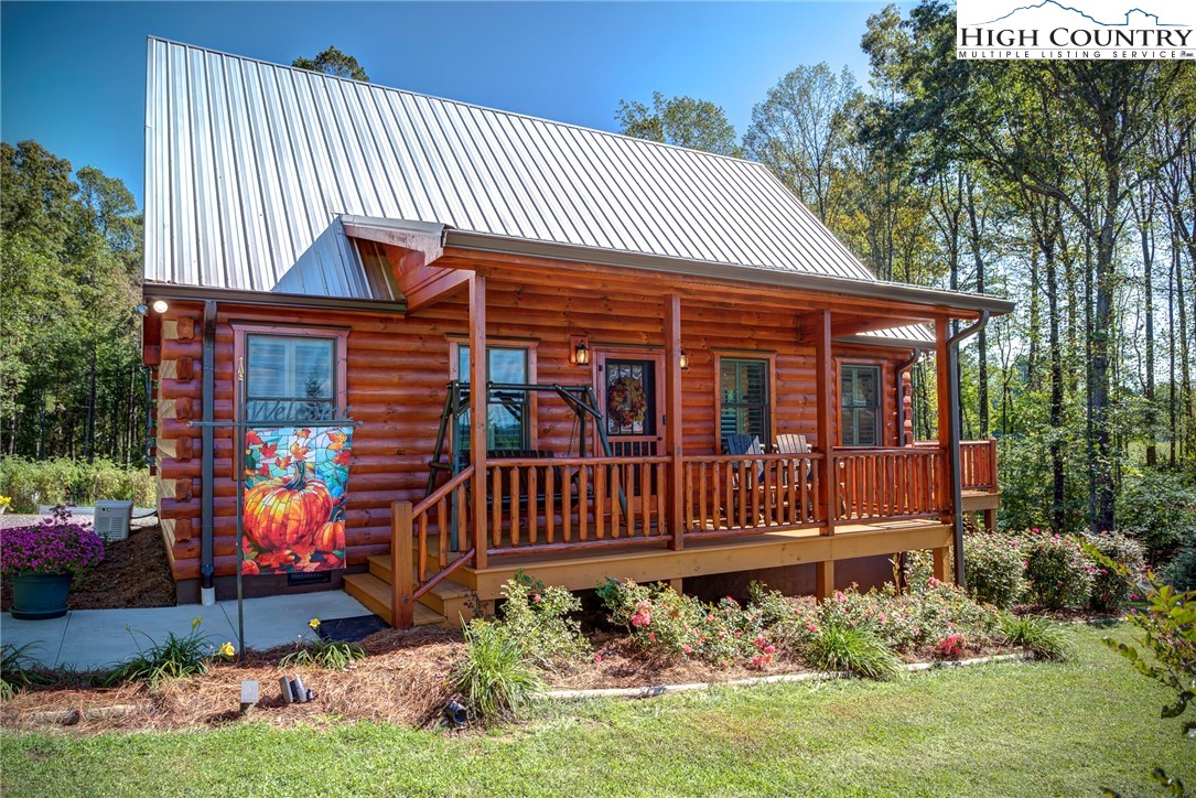 3460 South Center Church Road Thurmond, NC 28683 - Photo 1 of 50 a front view of a house with garden