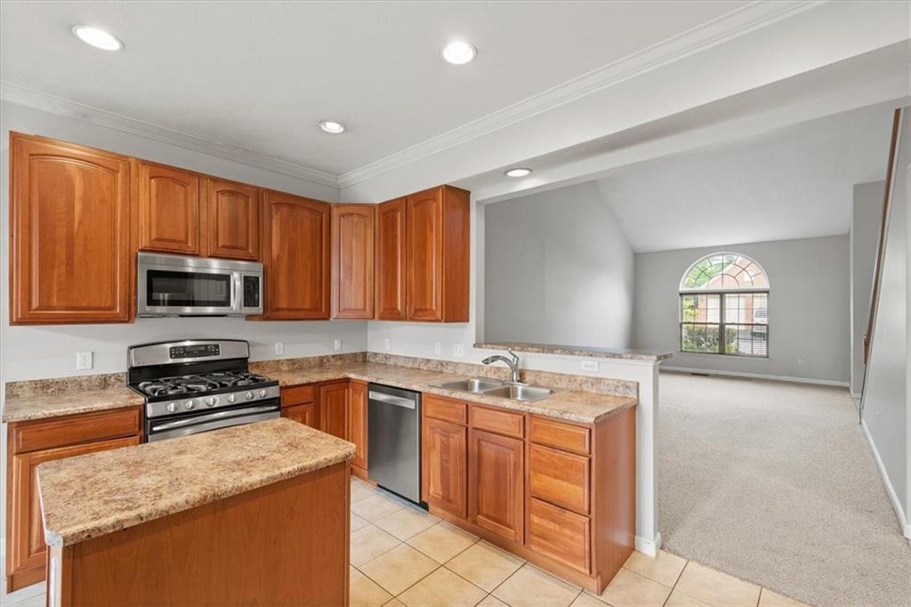125 Park Place McKees Rocks, PA 15136 - Photo 11 of 44 a kitchen with a sink stove top oven and microwave