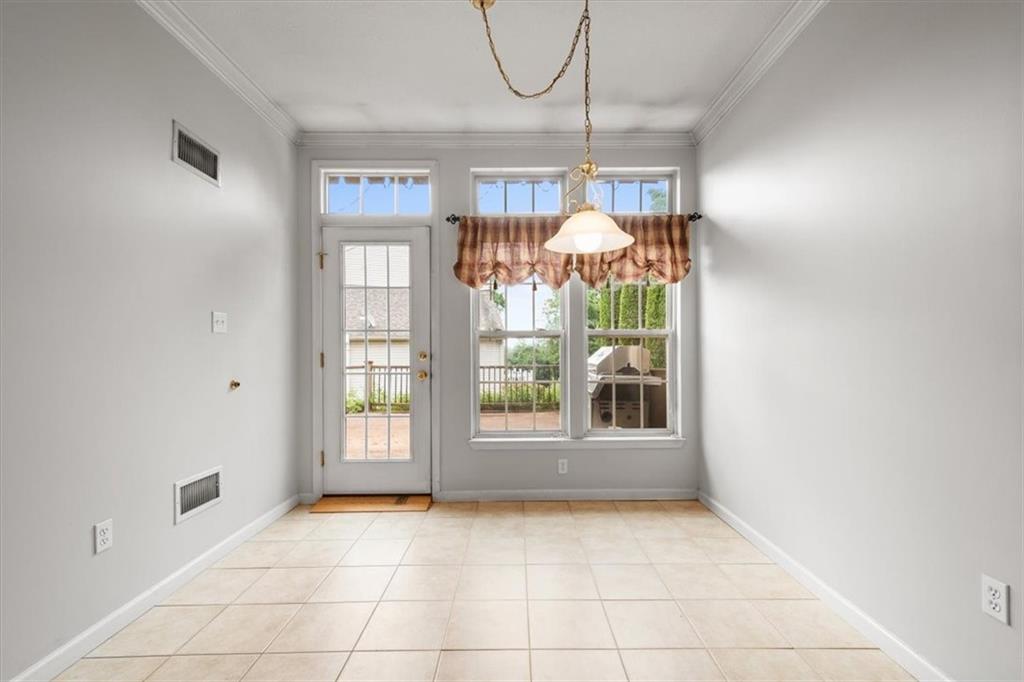 125 Park Place McKees Rocks, PA 15136 - Photo 12 of 44 a view of an empty room with window and chandelier fan