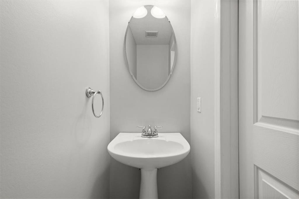 125 Park Place McKees Rocks, PA 15136 - Photo 18 of 44 a bathroom with a sink a mirror and a lamp