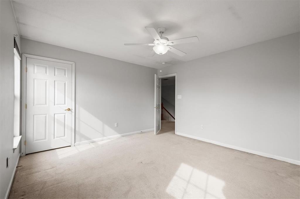 125 Park Place McKees Rocks, PA 15136 - Photo 28 of 44 an empty room with a ceiling fan and a window