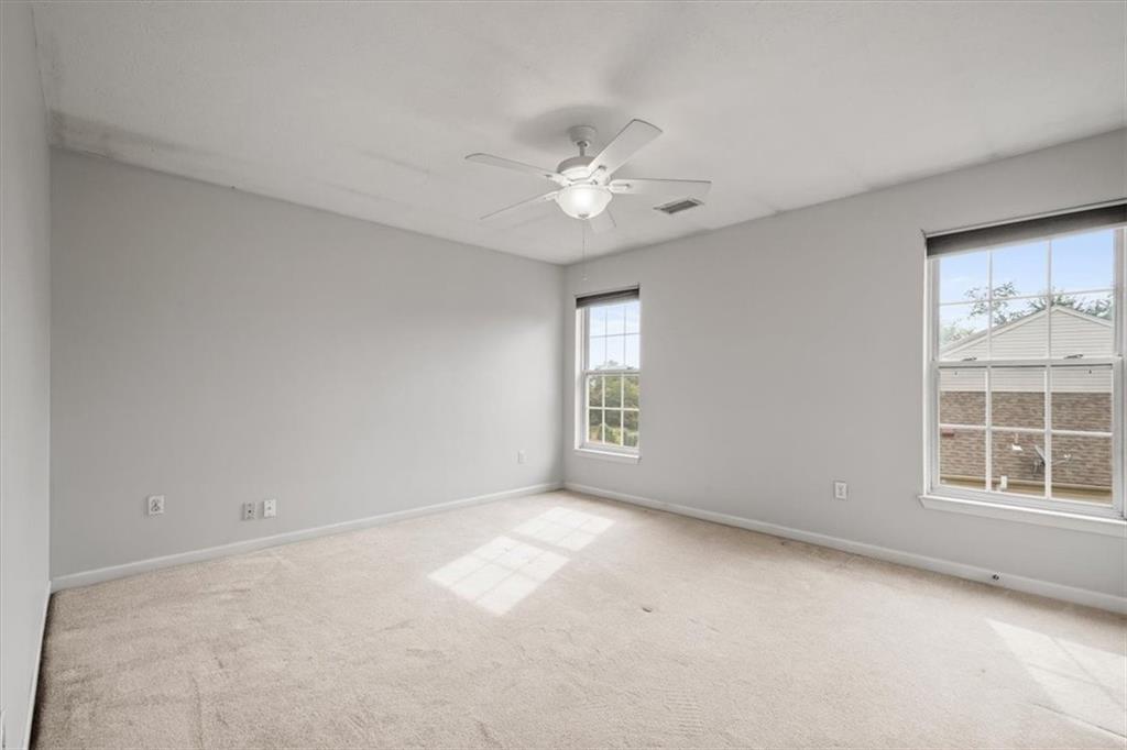 125 Park Place McKees Rocks, PA 15136 - Photo 32 of 44 an empty room with a window and a ceiling fan