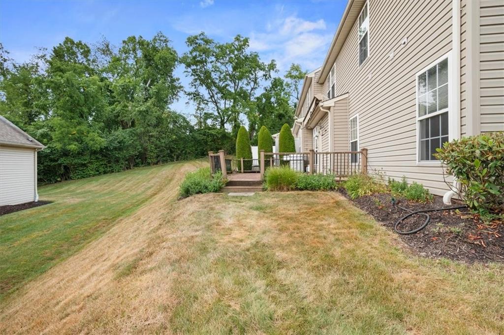 125 Park Place McKees Rocks, PA 15136 - Photo 39 of 44 a backyard of a house with plants and trees