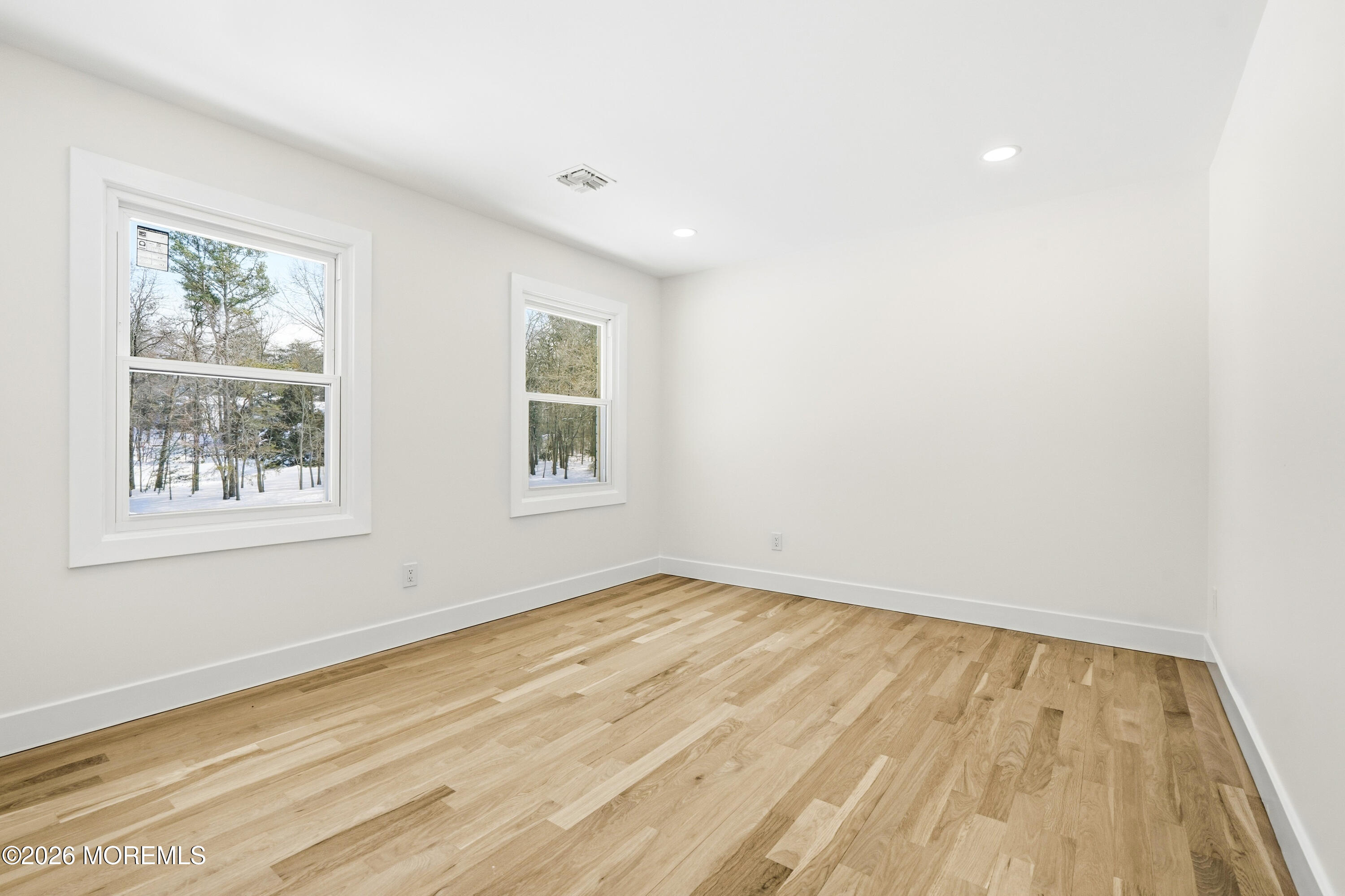 20 Overlook Drive Jackson, NJ 08527 - Photo 41 of 82 an empty room with wooden floor and windows