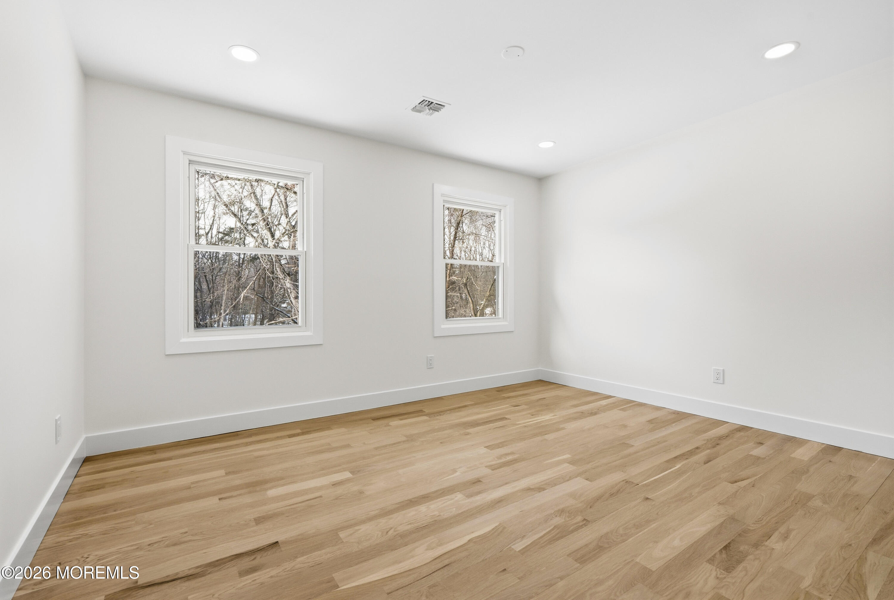 20 Overlook Drive Jackson, NJ 08527 - Photo 49 of 82 a view of an empty room with wooden floor and a window