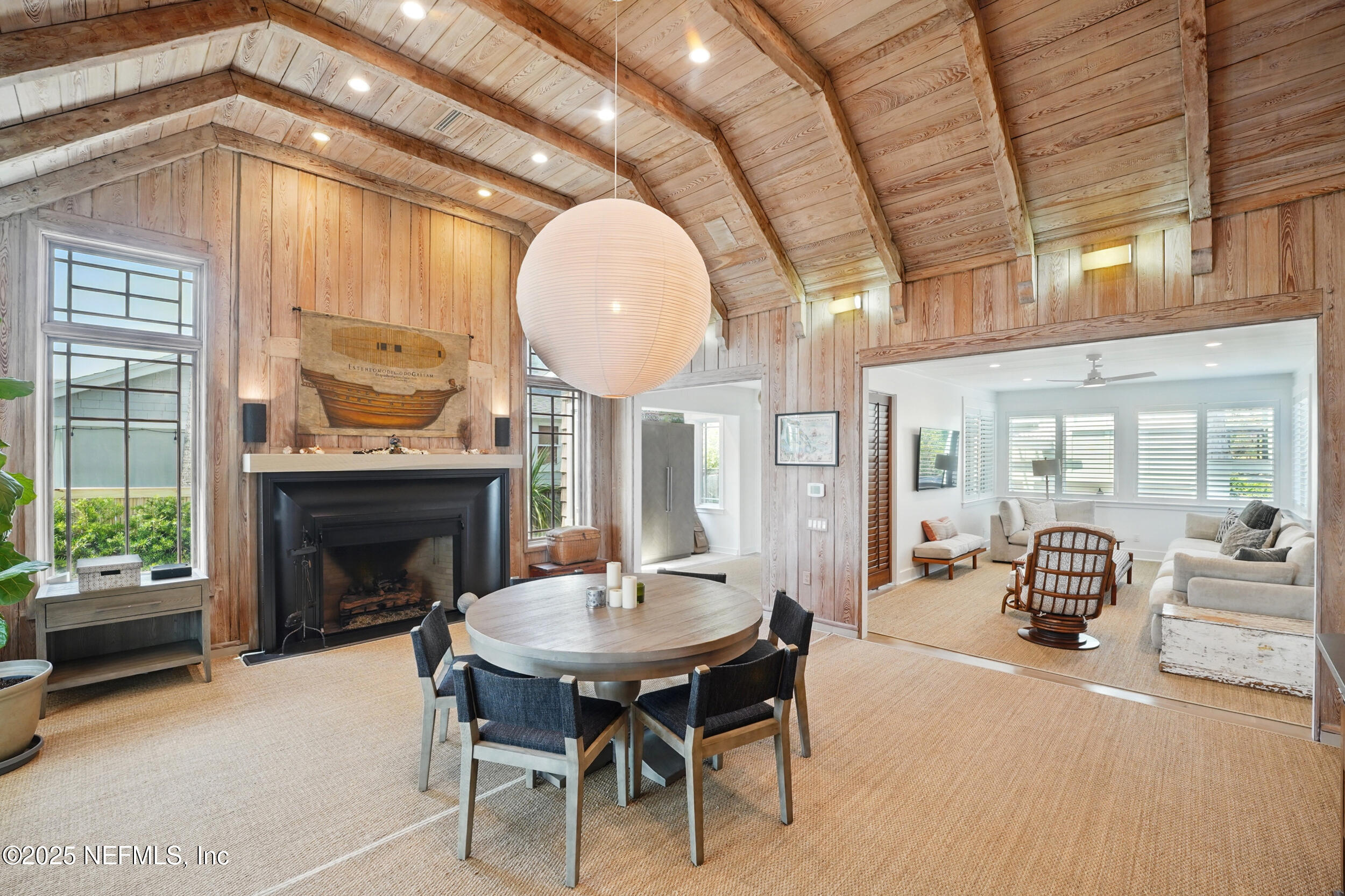 816 Ocean Front Neptune Beach, FL 32266 - Photo 12 of 65 a living room with furniture a fireplace and a large window