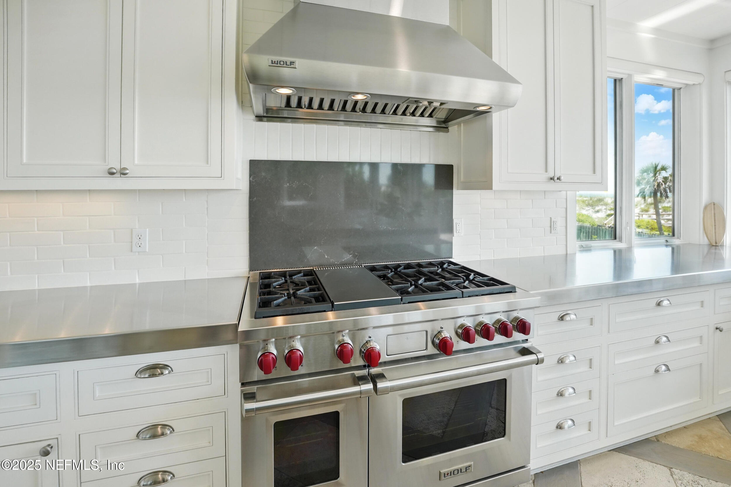 816 Ocean Front Neptune Beach, FL 32266 - Photo 17 of 65 a stove top oven sitting inside of a kitchen