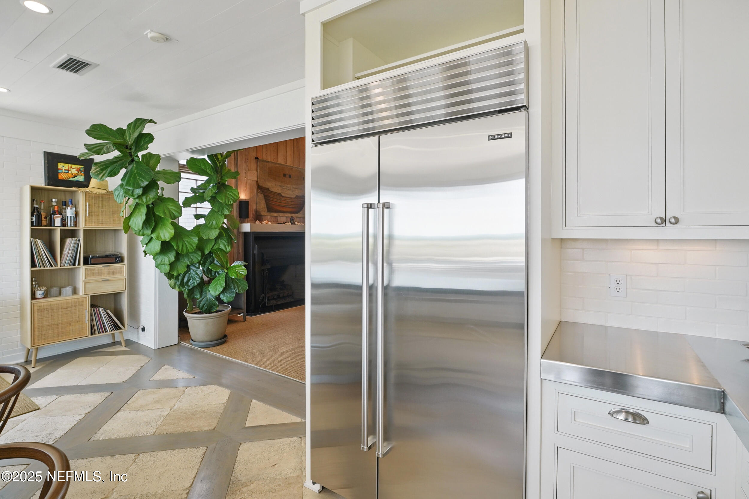 816 Ocean Front Neptune Beach, FL 32266 - Photo 18 of 65 a kitchen with a refrigerator and plant