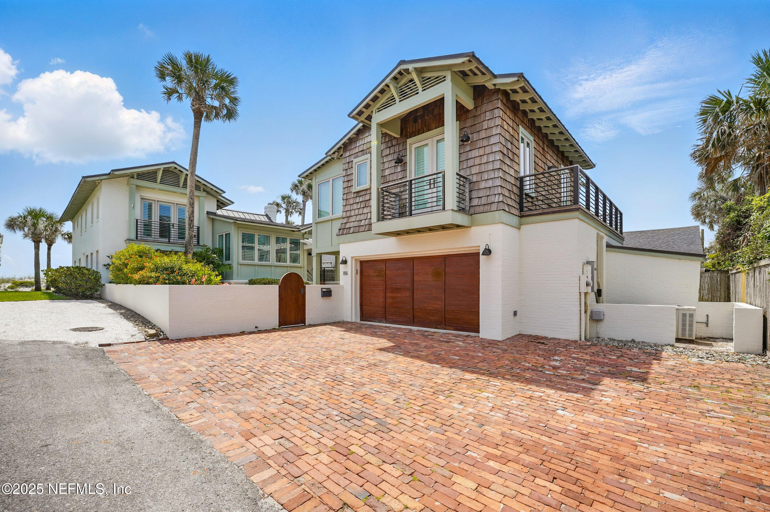 816 Ocean Front Neptune Beach, FL 32266 - Photo 2 of 65 a front view of a house with a yard and garage