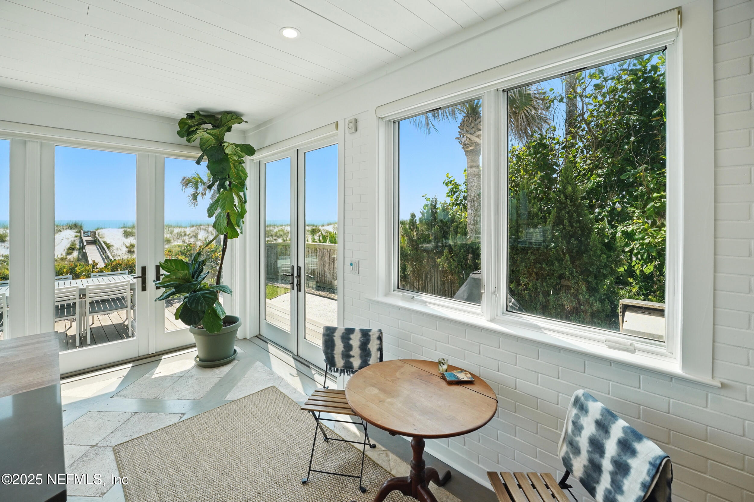 816 Ocean Front Neptune Beach, FL 32266 - Photo 22 of 65 a living room with furniture and a potted plant