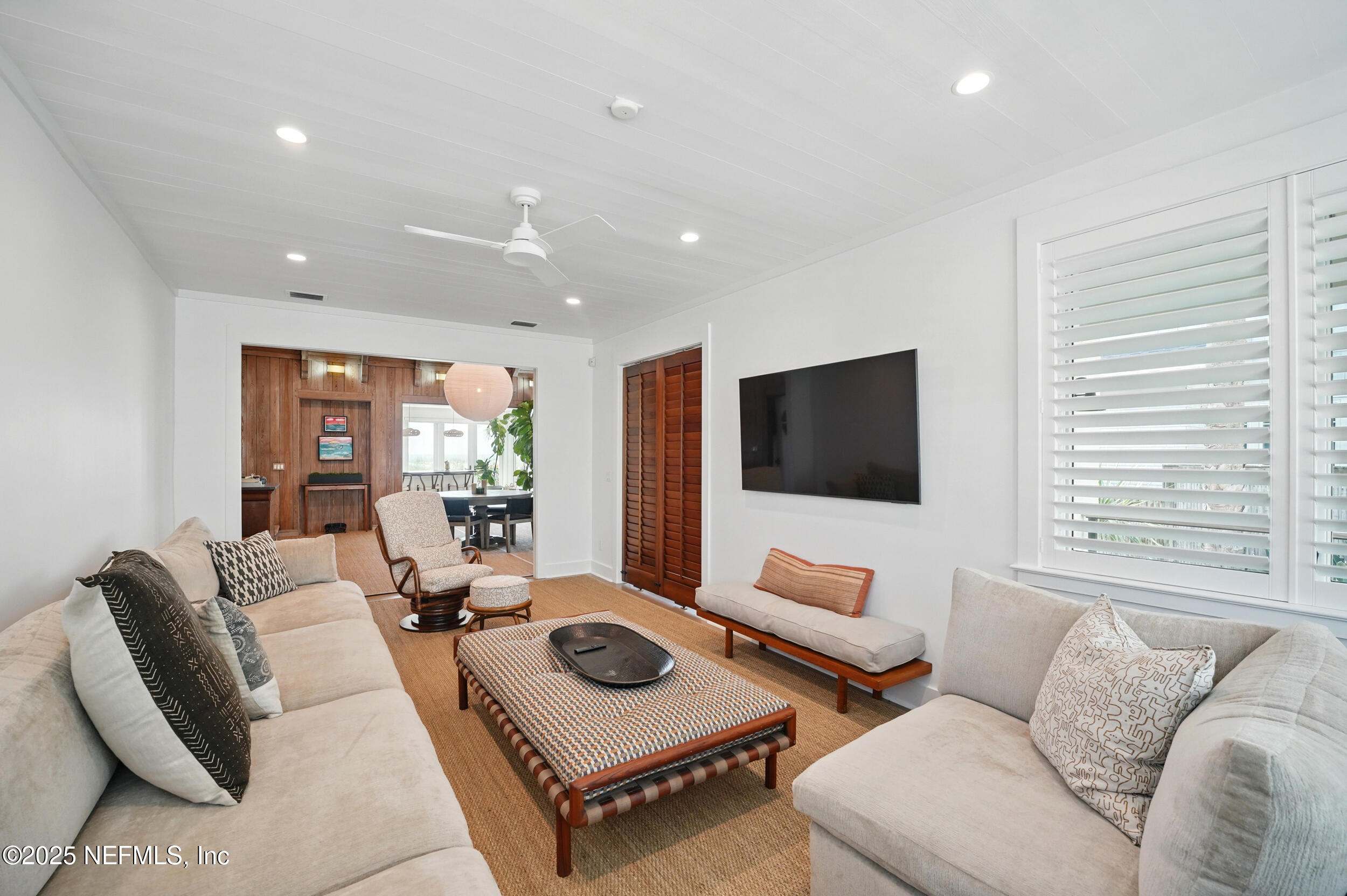 816 Ocean Front Neptune Beach, FL 32266 - Photo 24 of 65 a living room with furniture and a flat screen tv