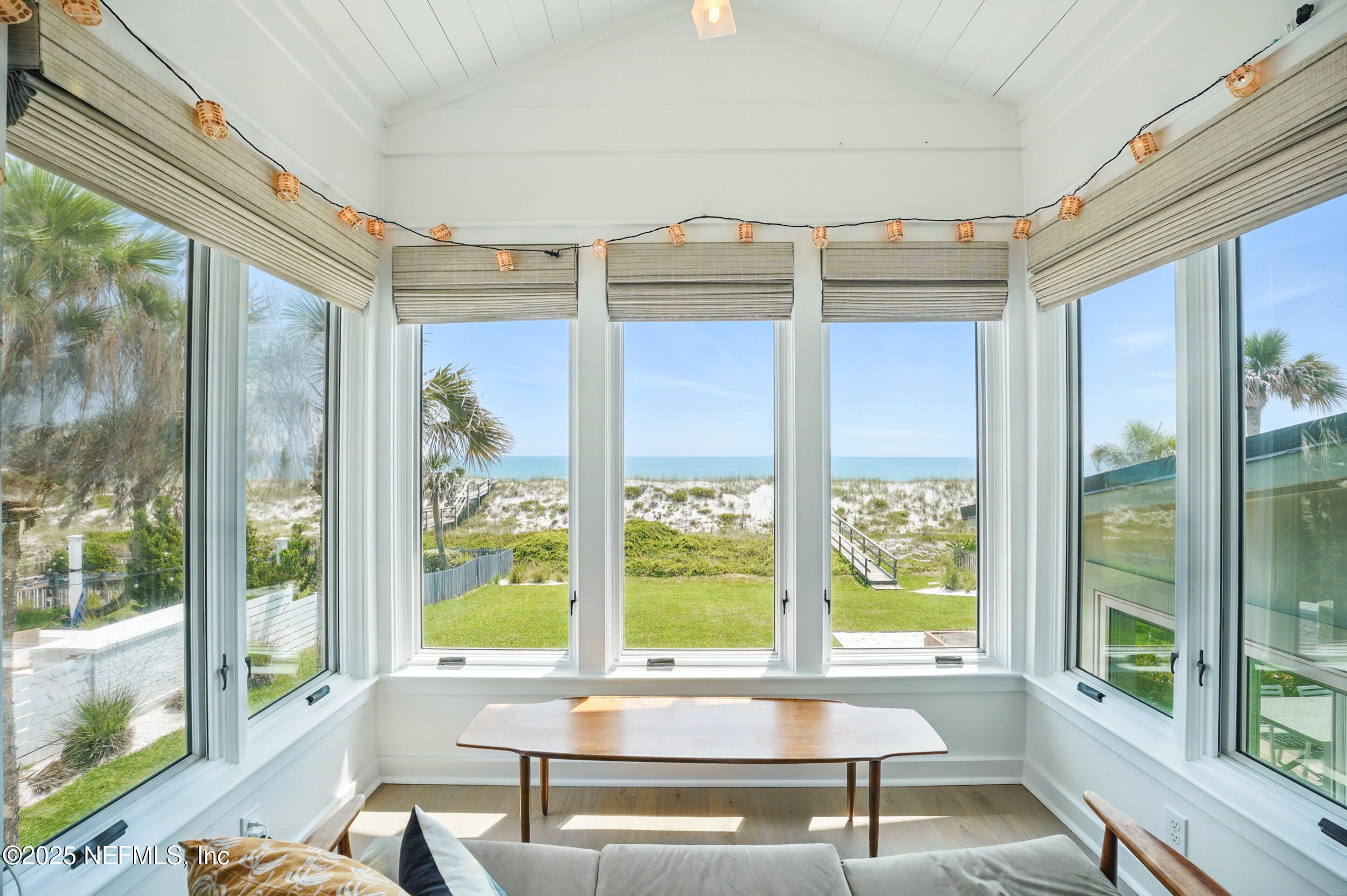 816 Ocean Front Neptune Beach, FL 32266 - Photo 27 of 65 a living room with hardwood floor and large windows