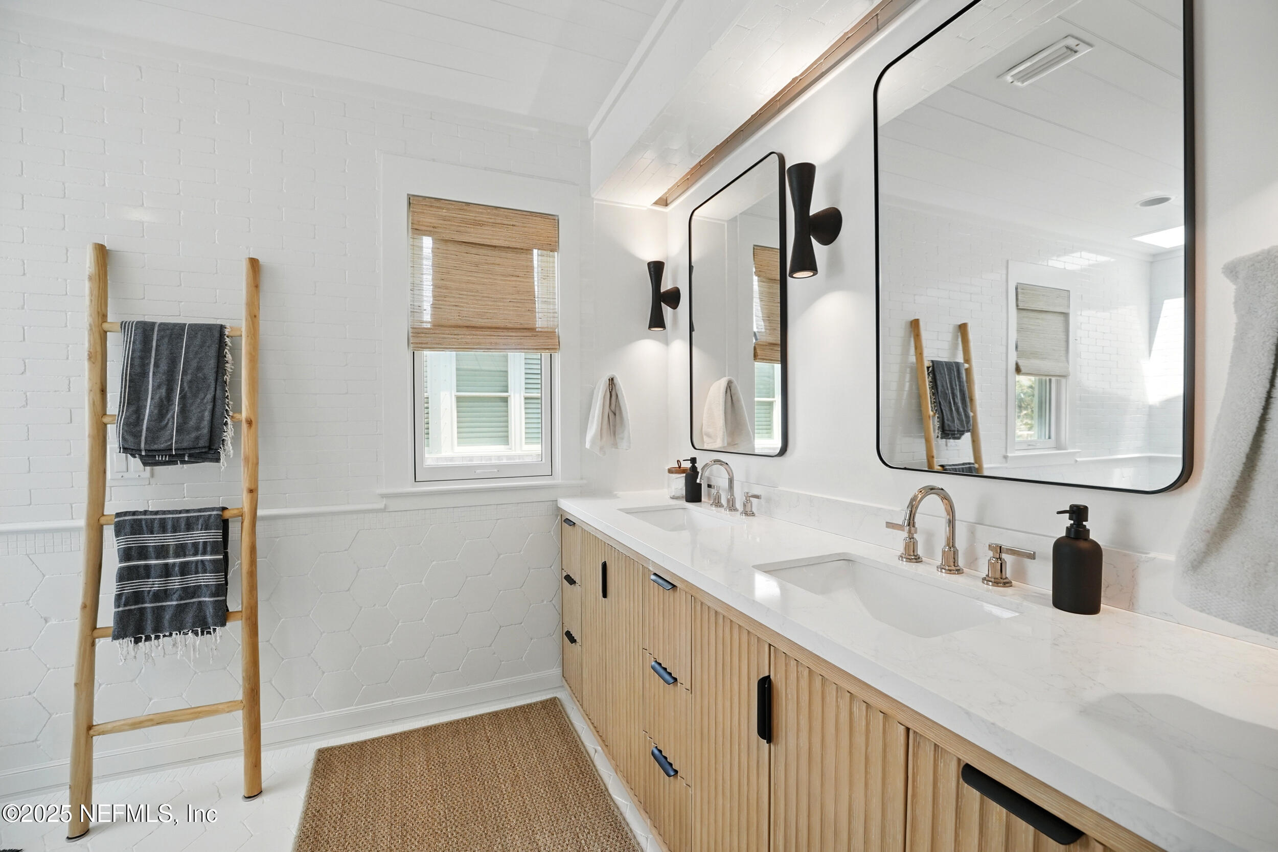 816 Ocean Front Neptune Beach, FL 32266 - Photo 29 of 65 a bathroom with a double vanity sink and mirror