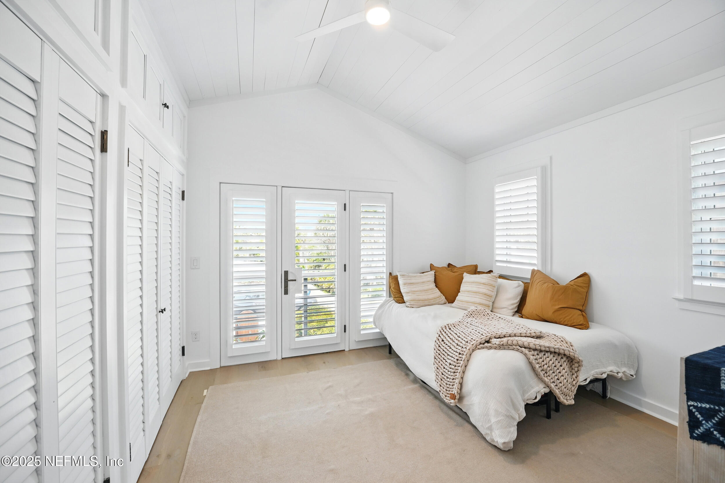 816 Ocean Front Neptune Beach, FL 32266 - Photo 32 of 65 a spacious bedroom with a bed and wooden floor