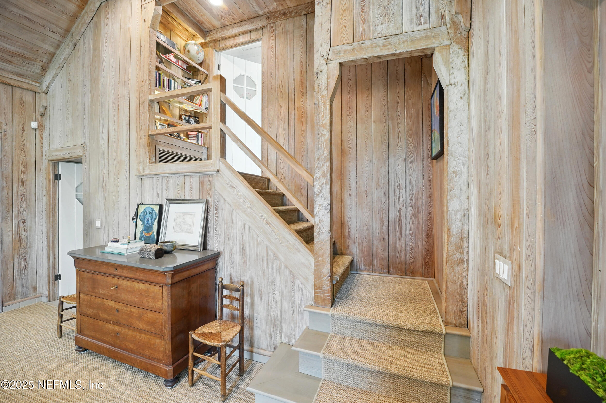 816 Ocean Front Neptune Beach, FL 32266 - Photo 34 of 65 a room with table and a painting on the wall