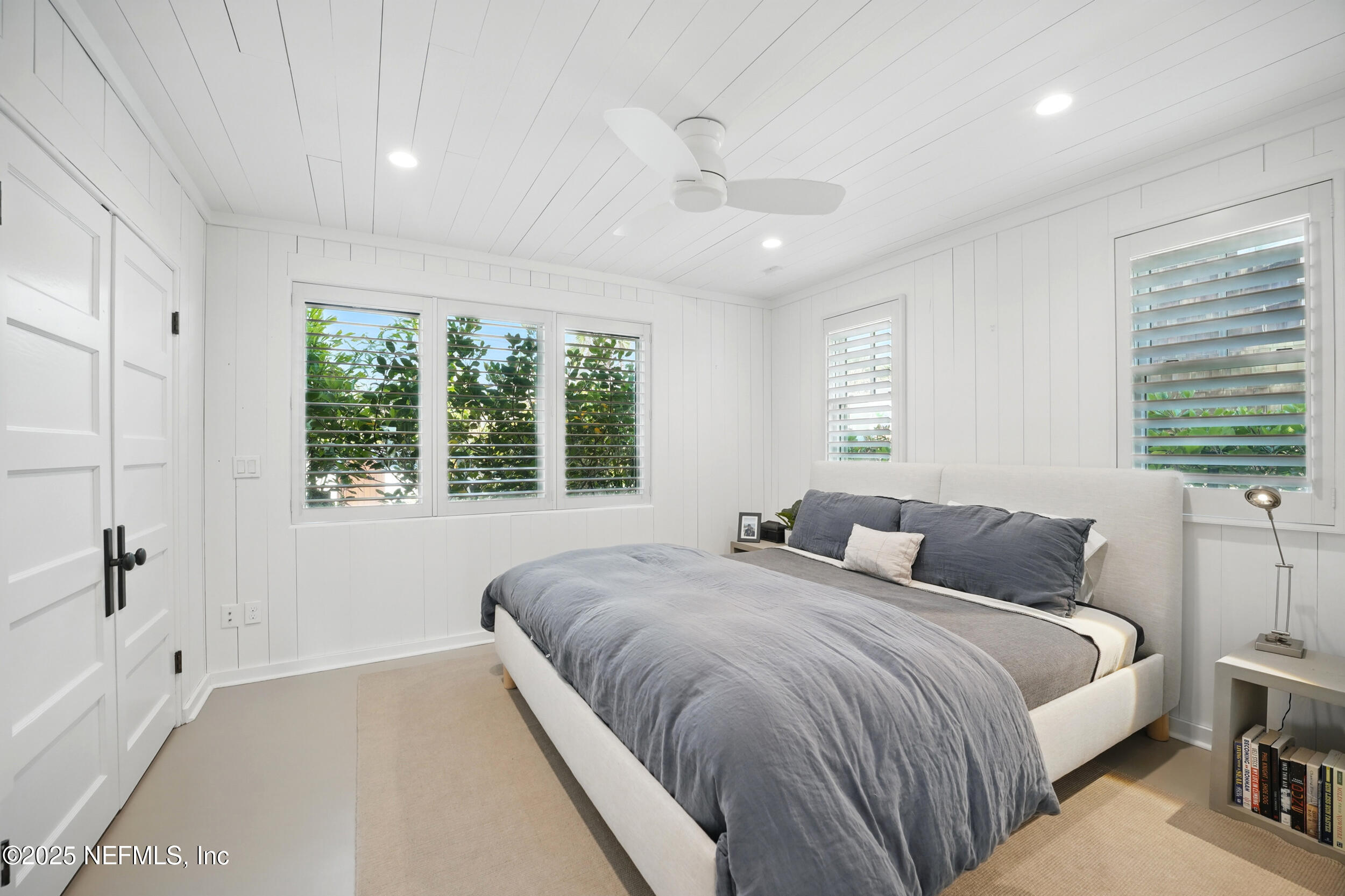 816 Ocean Front Neptune Beach, FL 32266 - Photo 35 of 65 a bedroom with a large bed and a large window