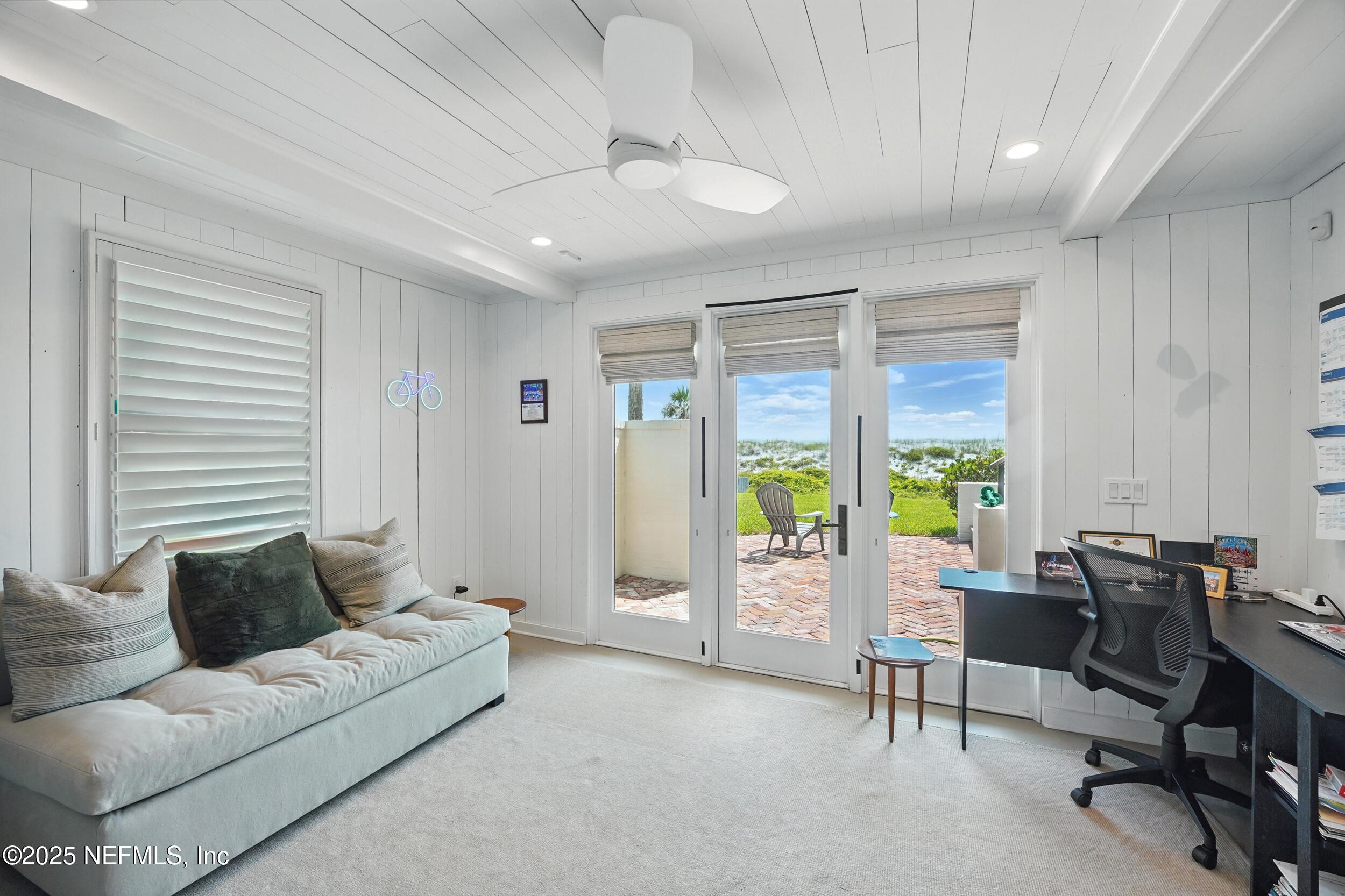 816 Ocean Front Neptune Beach, FL 32266 - Photo 39 of 65 a living room with furniture and a table