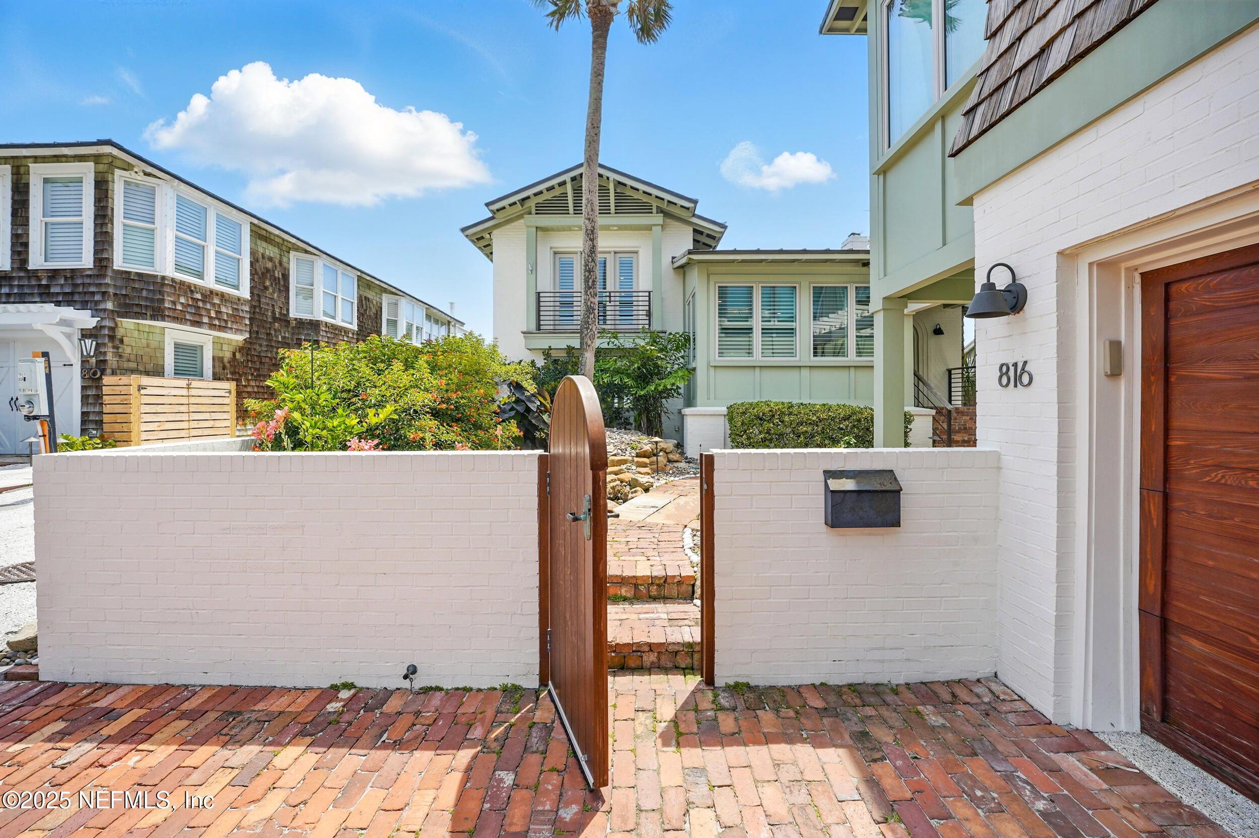816 Ocean Front Neptune Beach, FL 32266 - Photo 4 of 65 a front view of a house with a yard