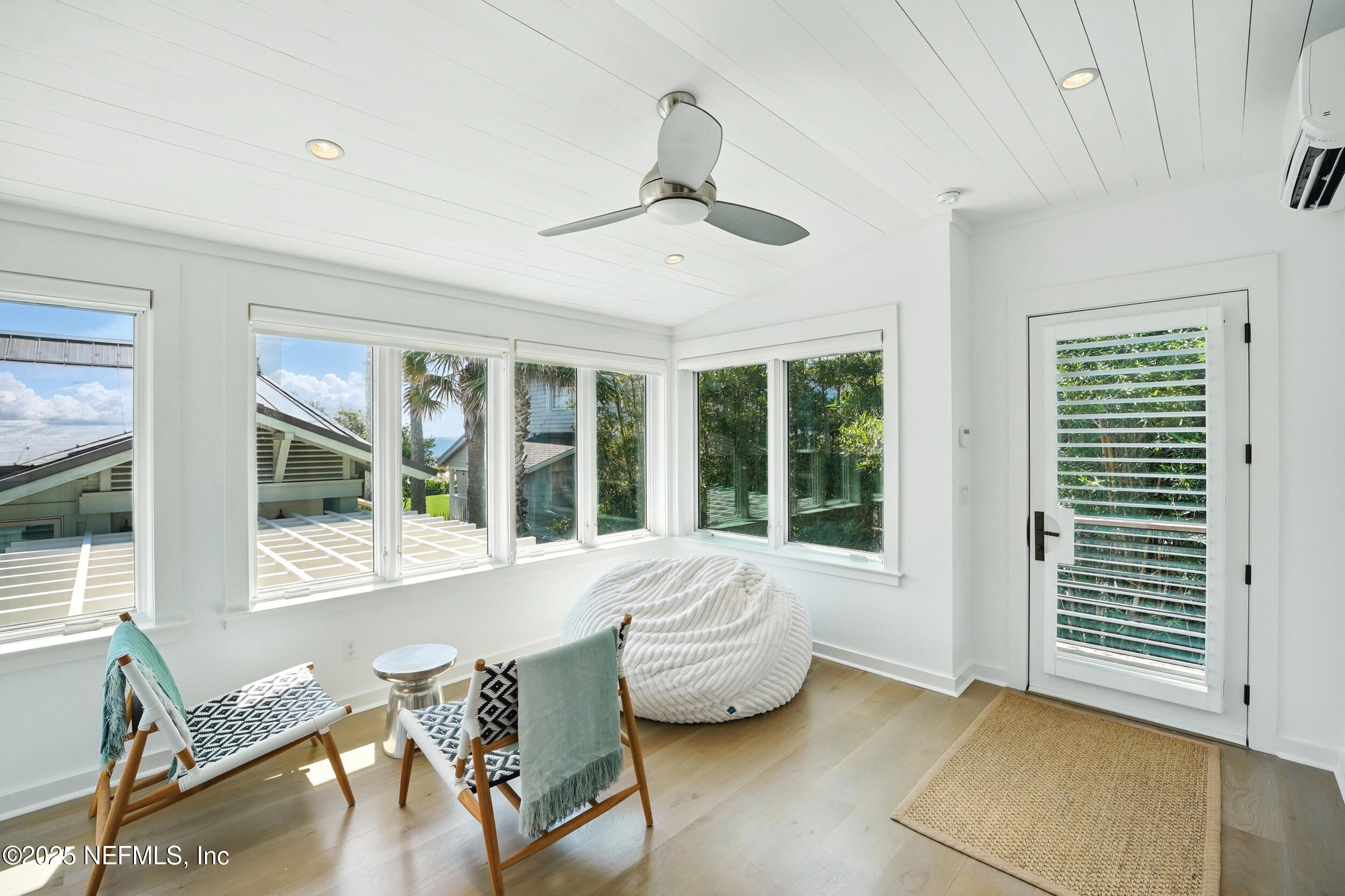 816 Ocean Front Neptune Beach, FL 32266 - Photo 43 of 65 a living room with furniture and windows