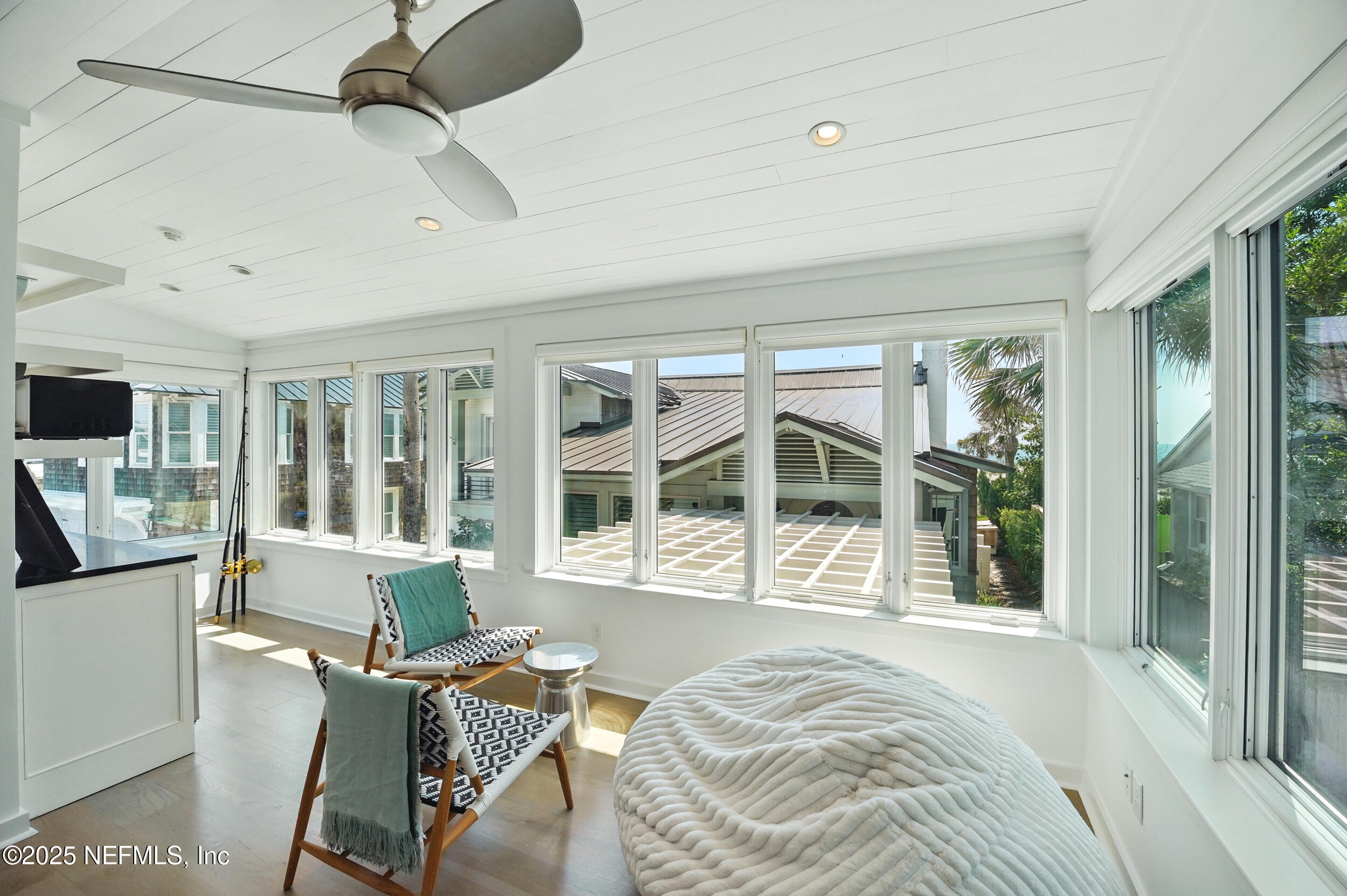 816 Ocean Front Neptune Beach, FL 32266 - Photo 44 of 65 a view of a bedroom with wooden floor and furniture