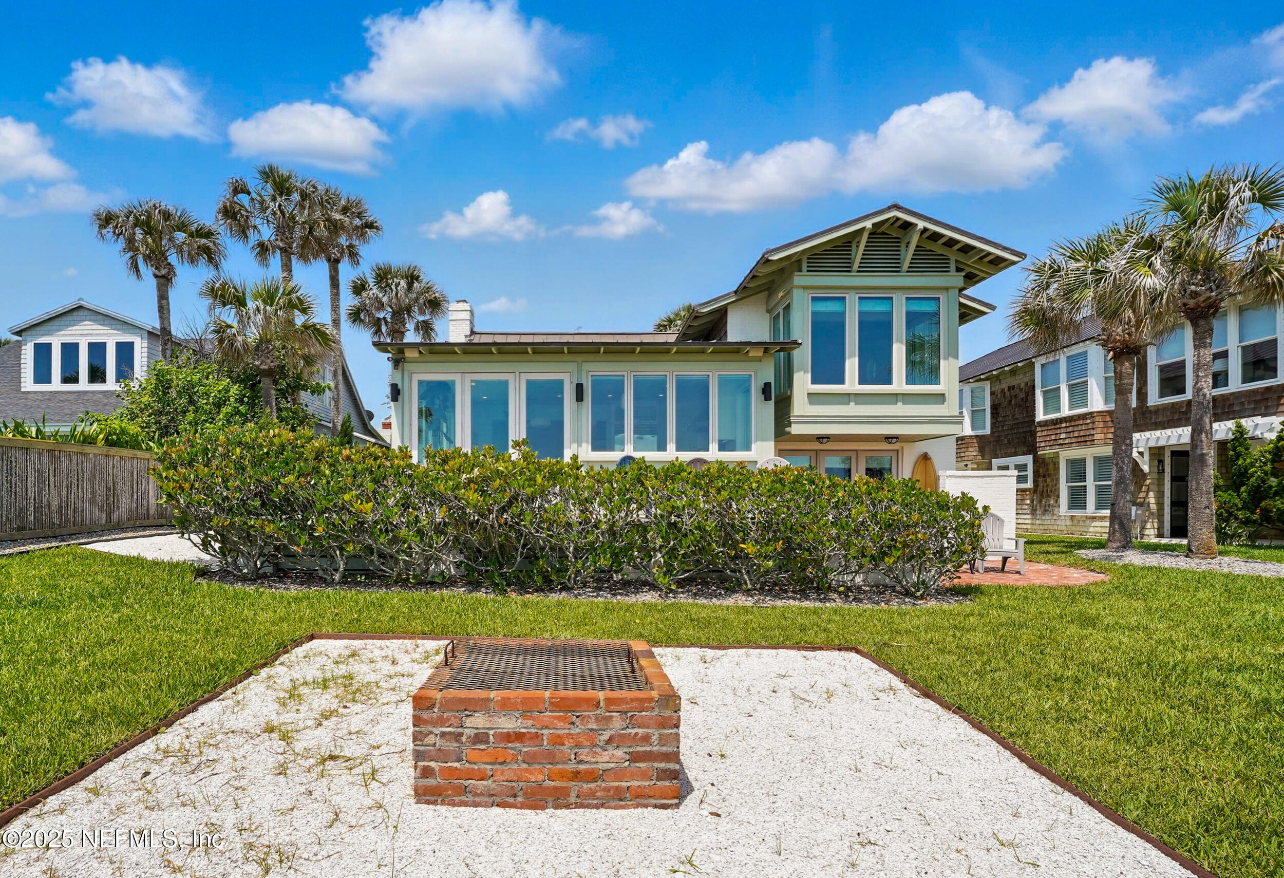 816 Ocean Front Neptune Beach, FL 32266 - Photo 55 of 65 a front view of a house with a yard