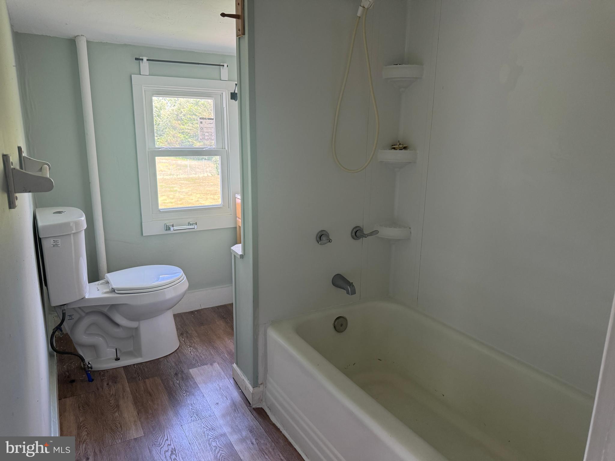 3754 Baltimore Pike, Unit 3 Littlestown, PA 17340 - Photo 13 of 21 a bathroom with a toilet and a bathtub