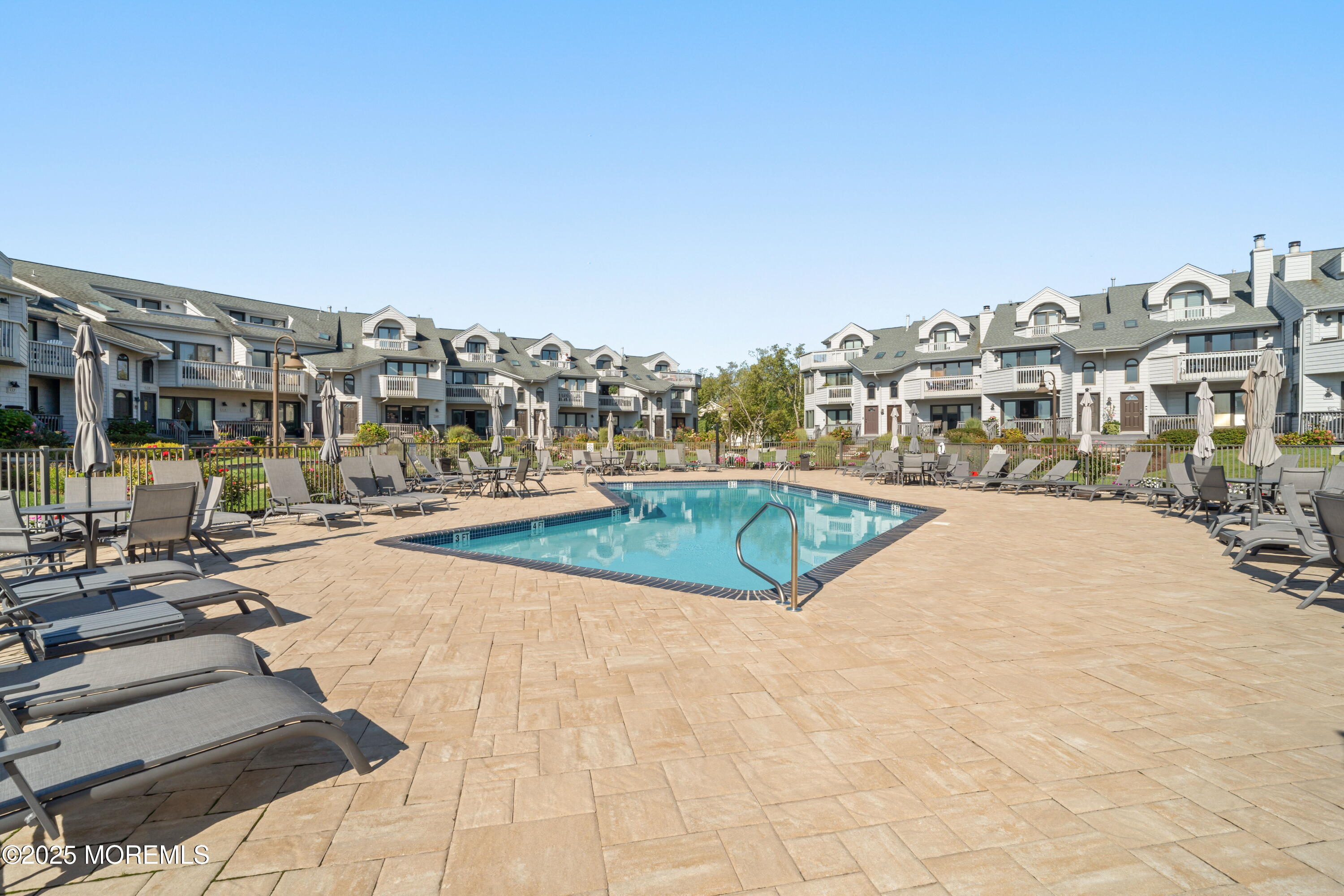 118 Ashley Avenue Brielle, NJ 08730 - Photo 15 of 34 a view of a swimming pool and a buildings