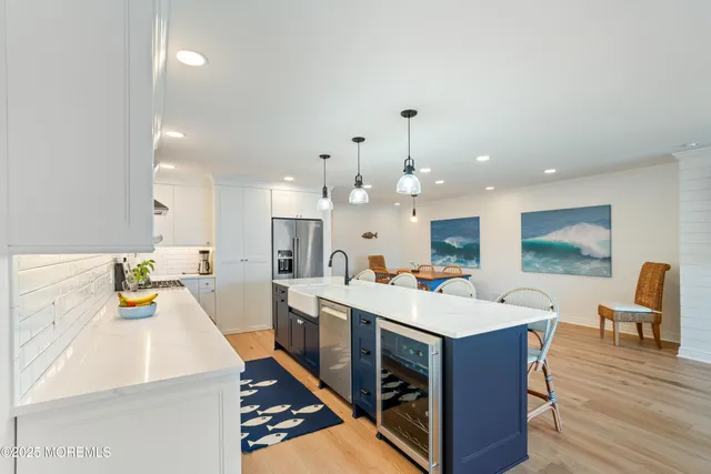 a large kitchen with a table and chairs