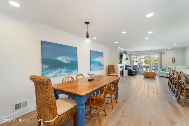 a dining room with furniture and wooden floor
