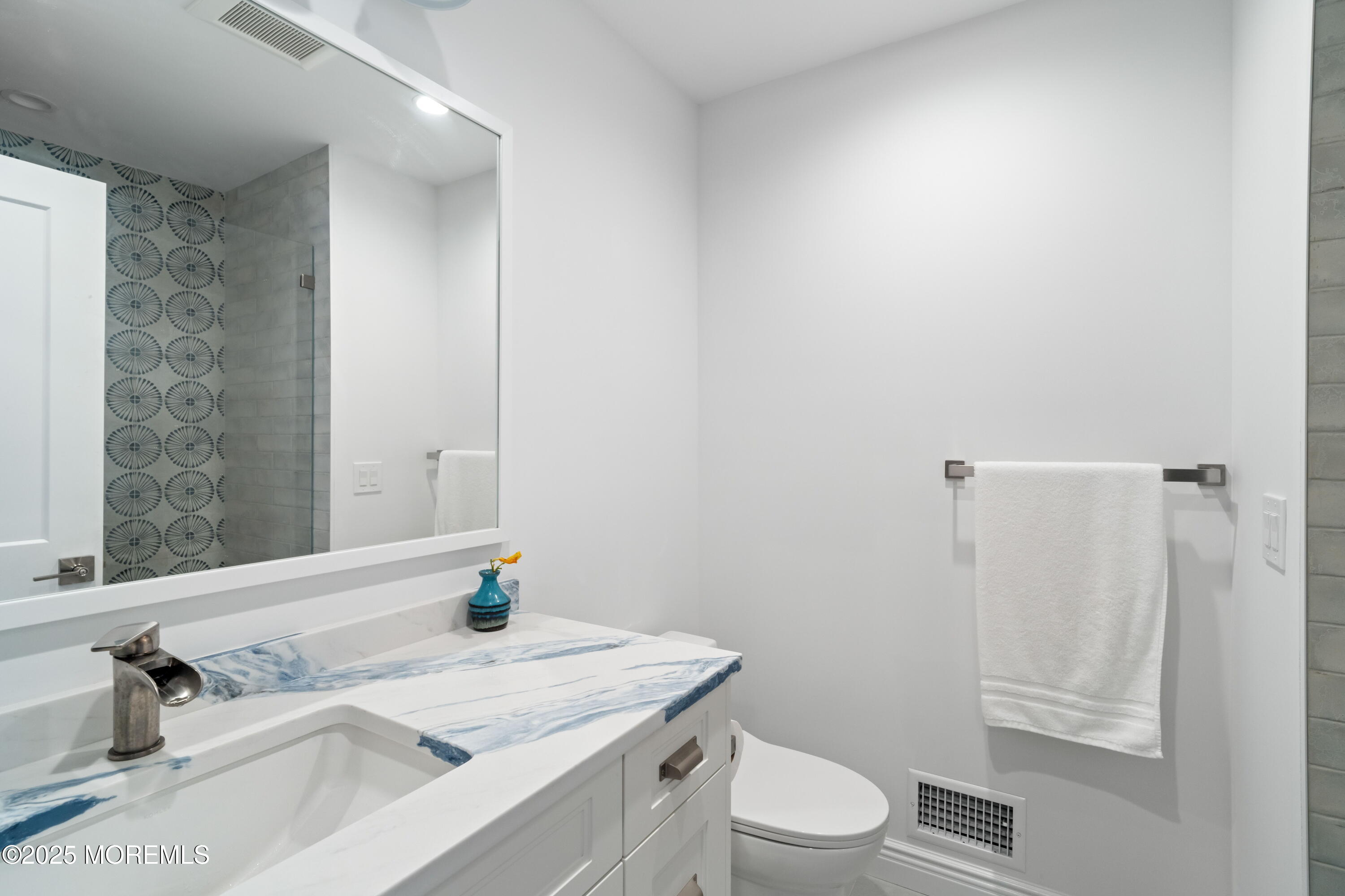 118 Ashley Avenue Brielle, NJ 08730 - Photo 22 of 34 a bathroom with a granite countertop sink toilet a mirror and shower