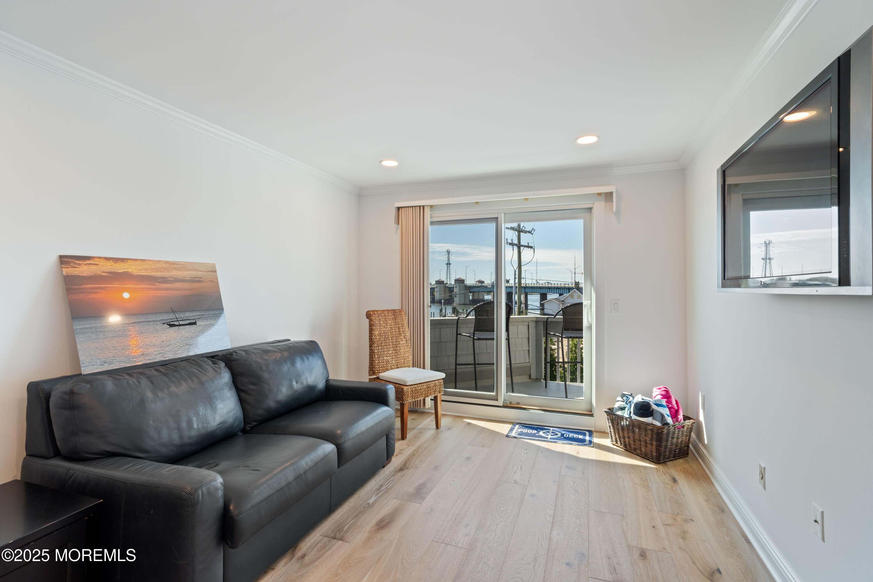 118 Ashley Avenue Brielle, NJ 08730 - Photo 30 of 34 a living room with furniture and a floor to ceiling window