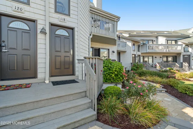 a view of a building with potted plants
