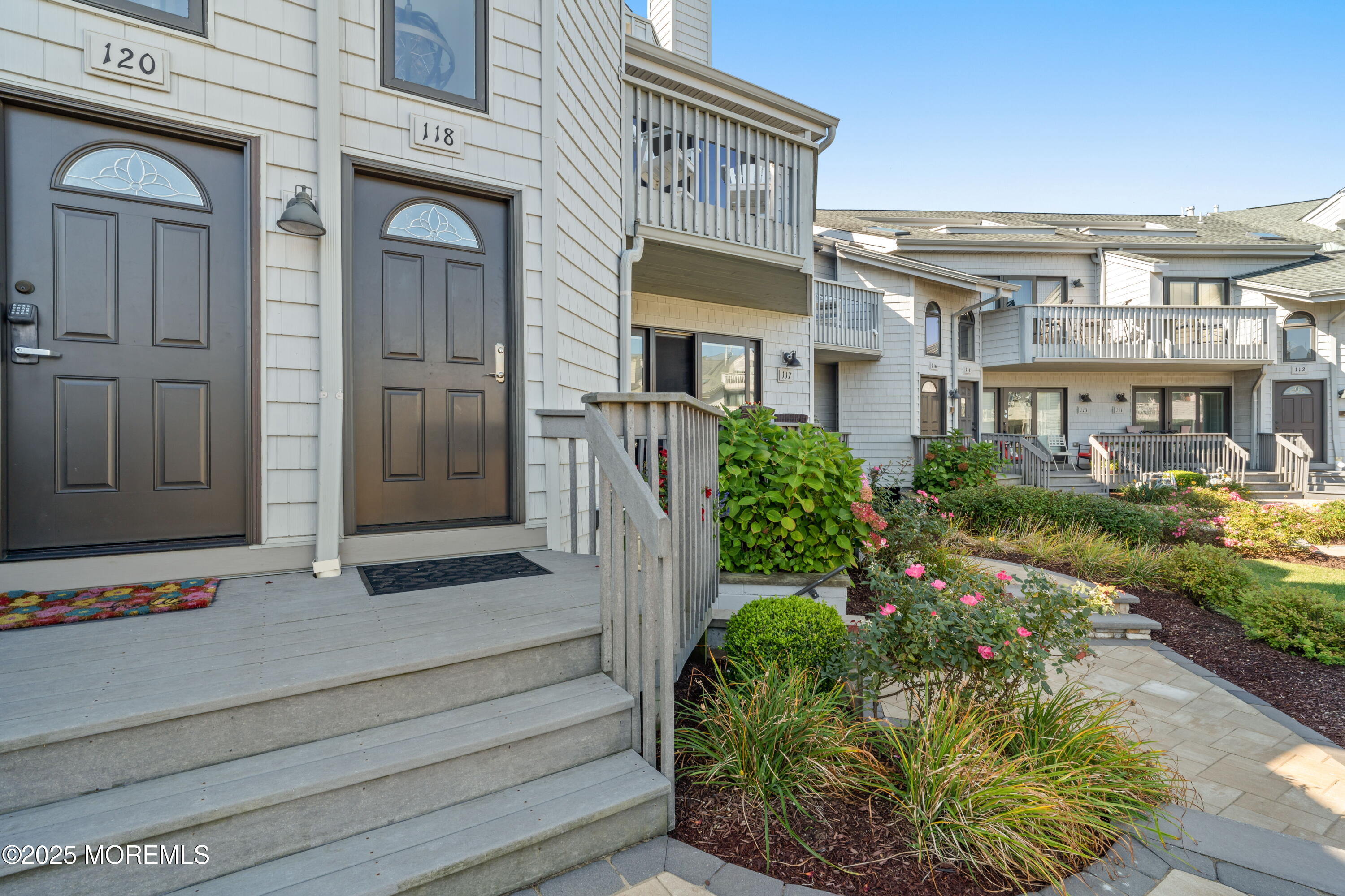 118 Ashley Avenue Brielle, NJ 08730 - Photo 3 of 34 a view of a building with potted plants