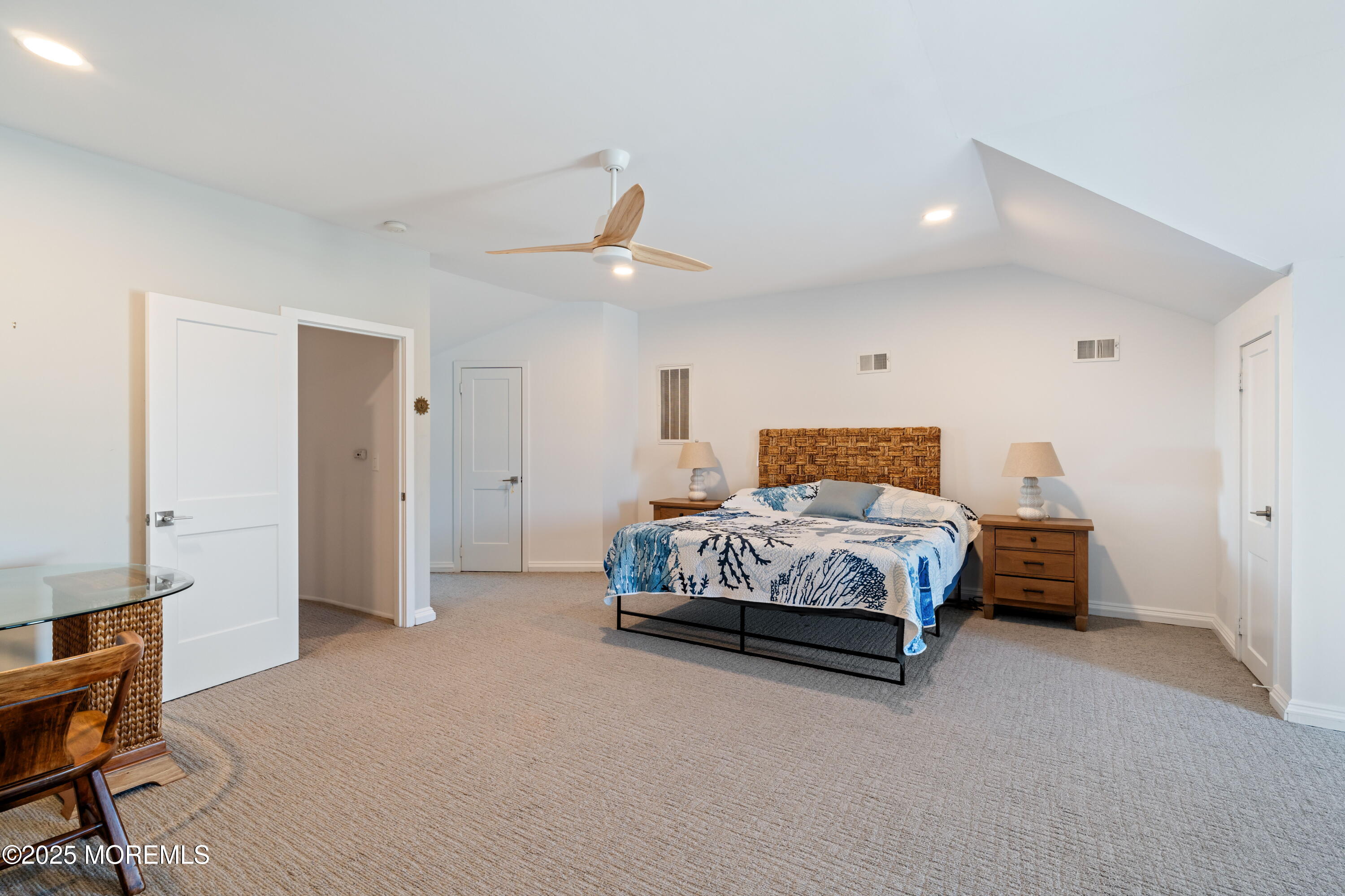 118 Ashley Avenue Brielle, NJ 08730 - Photo 32 of 34 a bedroom with a bed and a chandelier