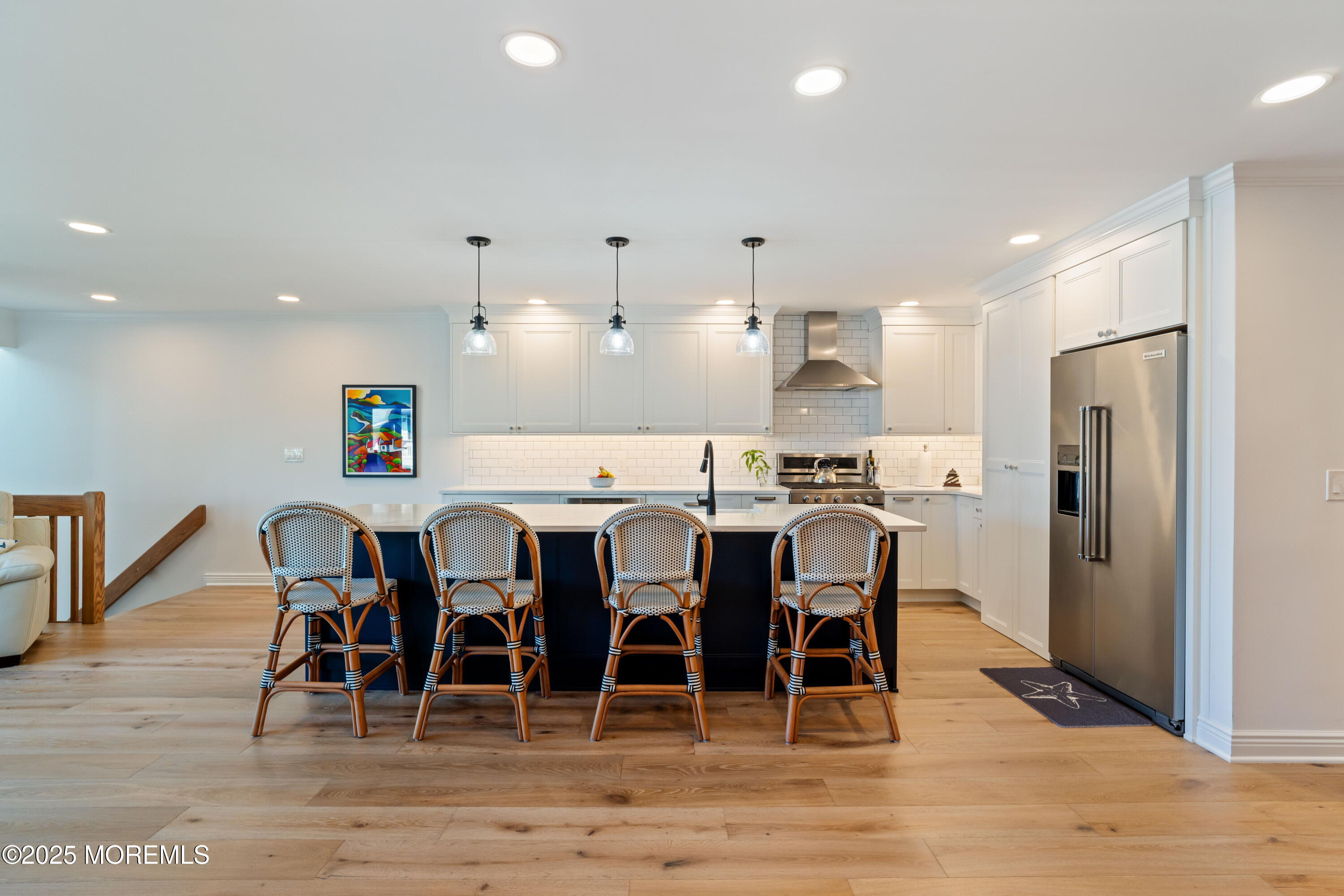 118 Ashley Avenue Brielle, NJ 08730 - Photo 8 of 34 a large kitchen with a dining table chairs and refrigerator