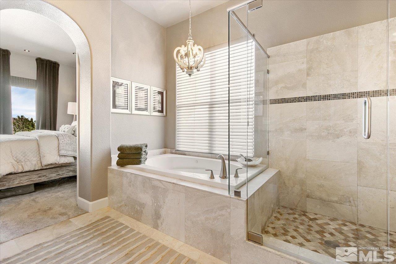2956 Flint Ridge Court Reno, NV 89511 - Photo 25 of 40 a spacious bathroom with a sink and a bathtub