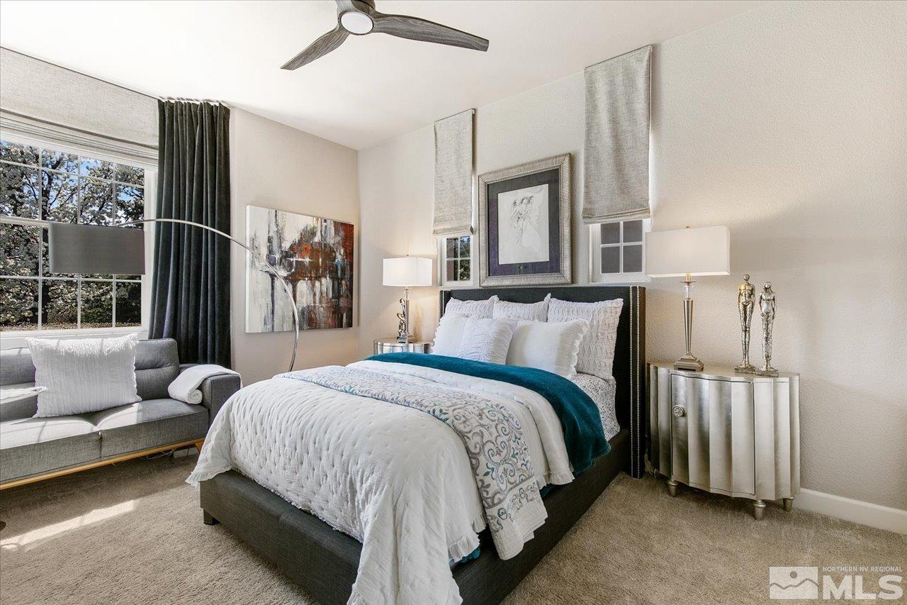 2956 Flint Ridge Court Reno, NV 89511 - Photo 26 of 40 a spacious bedroom with a bed and a couch