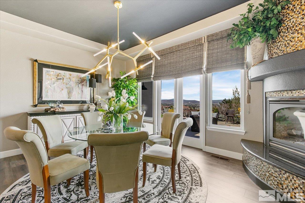 2956 Flint Ridge Court Reno, NV 89511 - Photo 8 of 40 a dining room with furniture and a floor to ceiling window