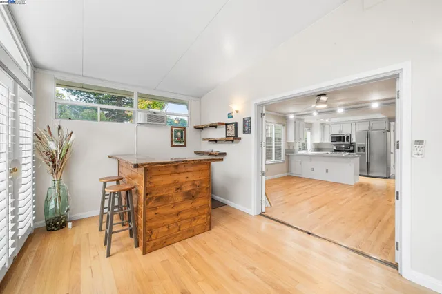 a view of kitchen with furniture and wooden floor