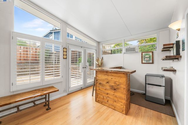 a bedroom with furniture and a window