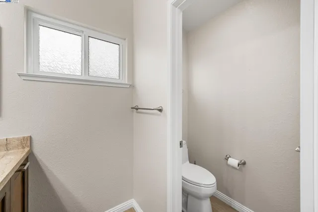 a bathroom with a toilet and a sink