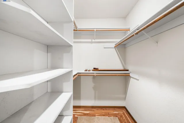 a view of an empty walk in closet