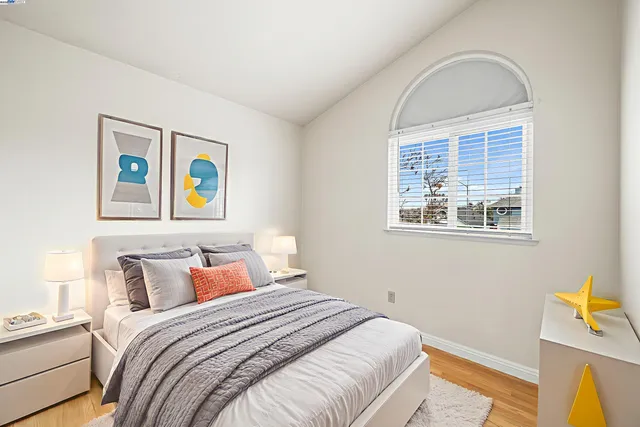 a bedroom with bed and window