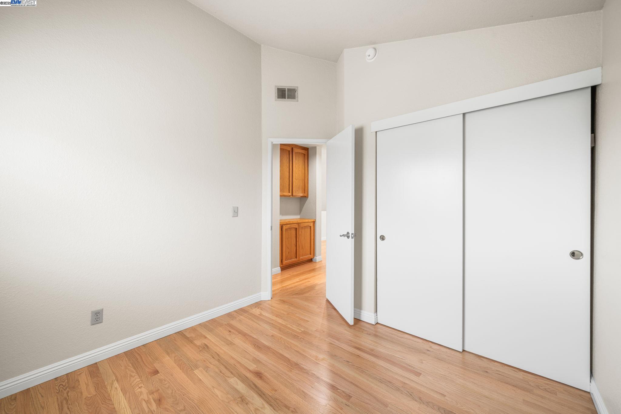 2864 El Capitan Drive Pleasanton, CA 94566 - Photo 35 of 45 a view of an empty room with wooden floor and a bathroom