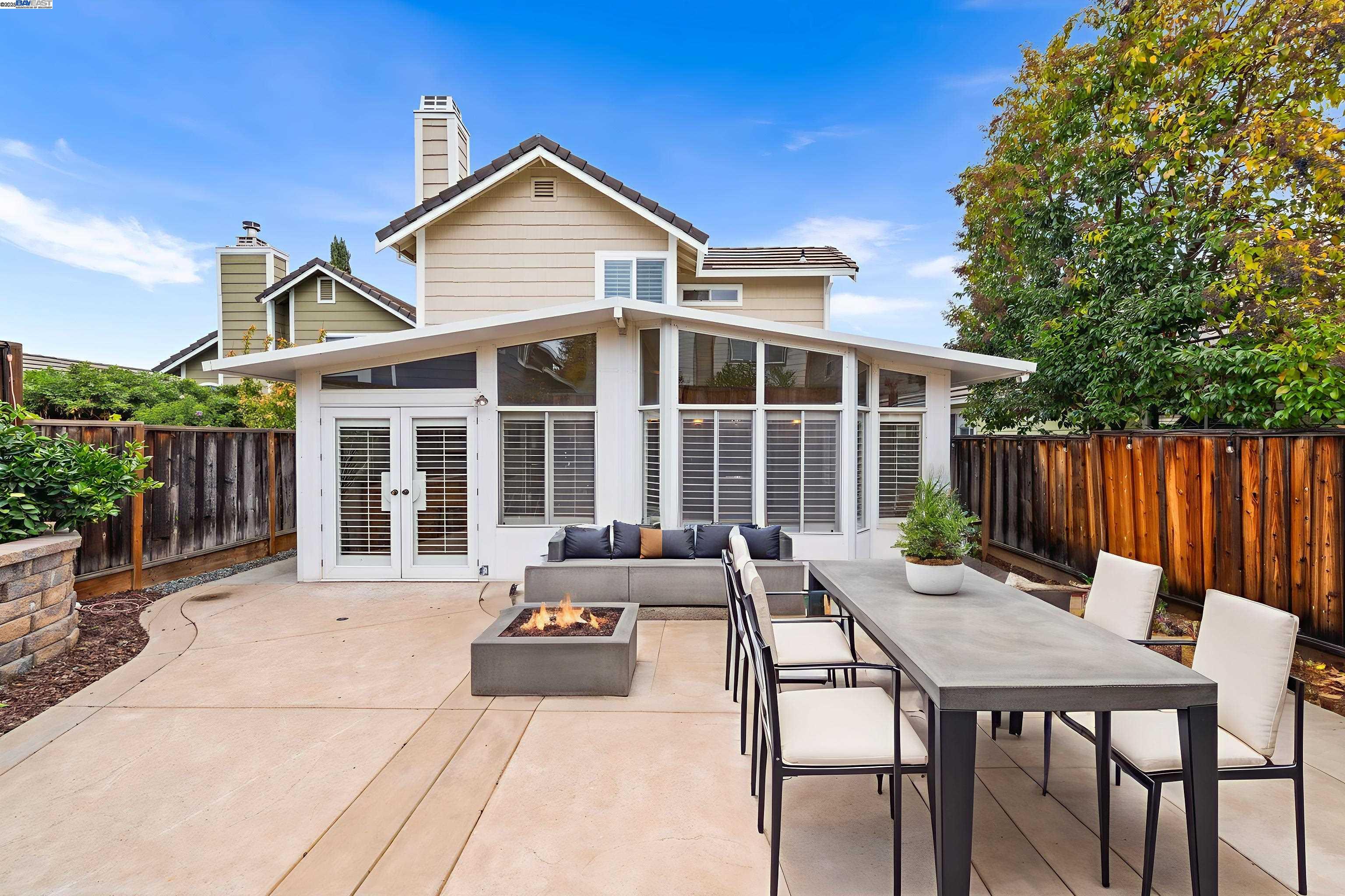 2864 El Capitan Drive Pleasanton, CA 94566 - Photo 39 of 45 a view of a house with a dining table and chairs
