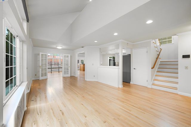 a view of a living room with wooden floor