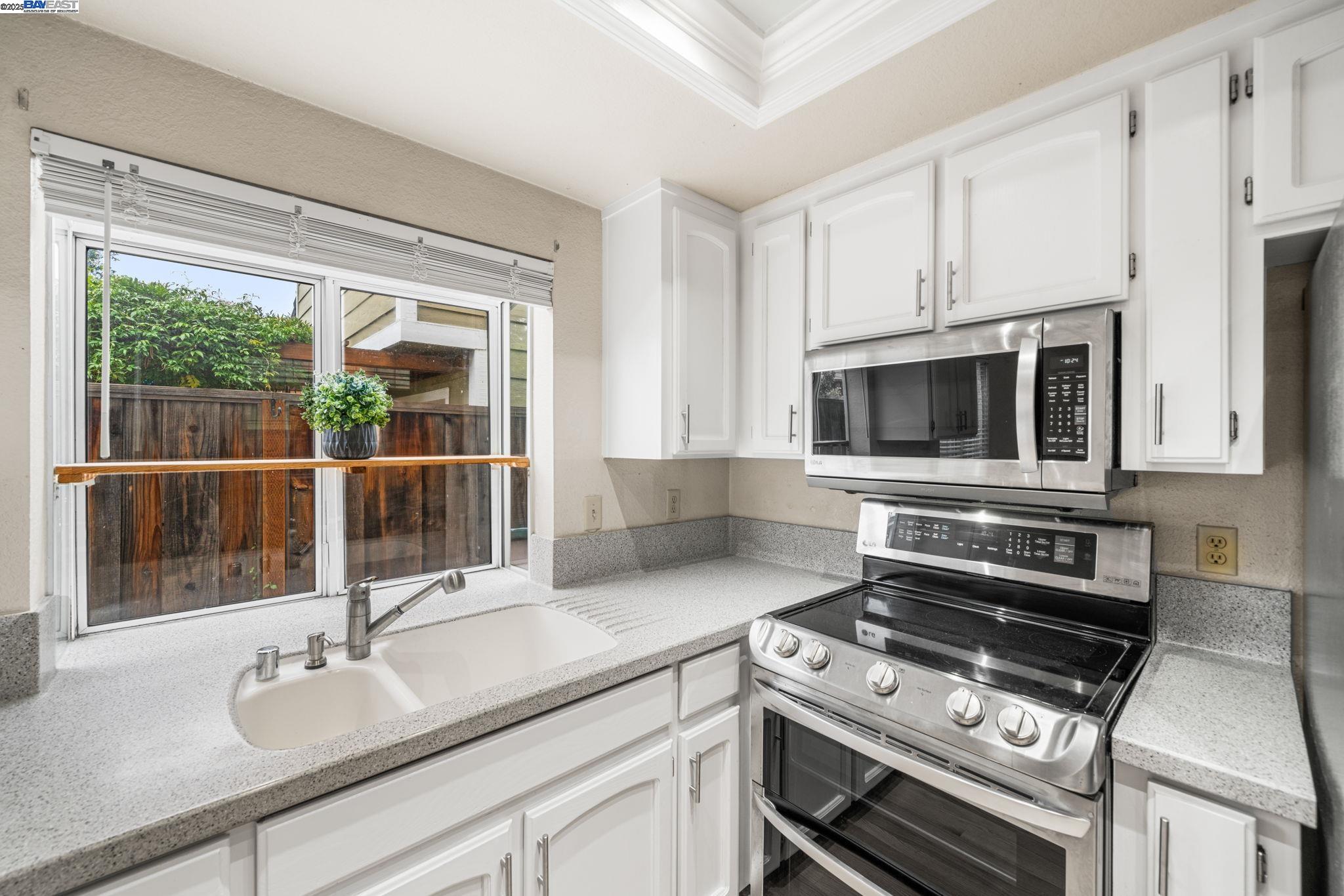 2864 El Capitan Drive Pleasanton, CA 94566 - Photo 7 of 45 a kitchen with a sink and a stove top oven