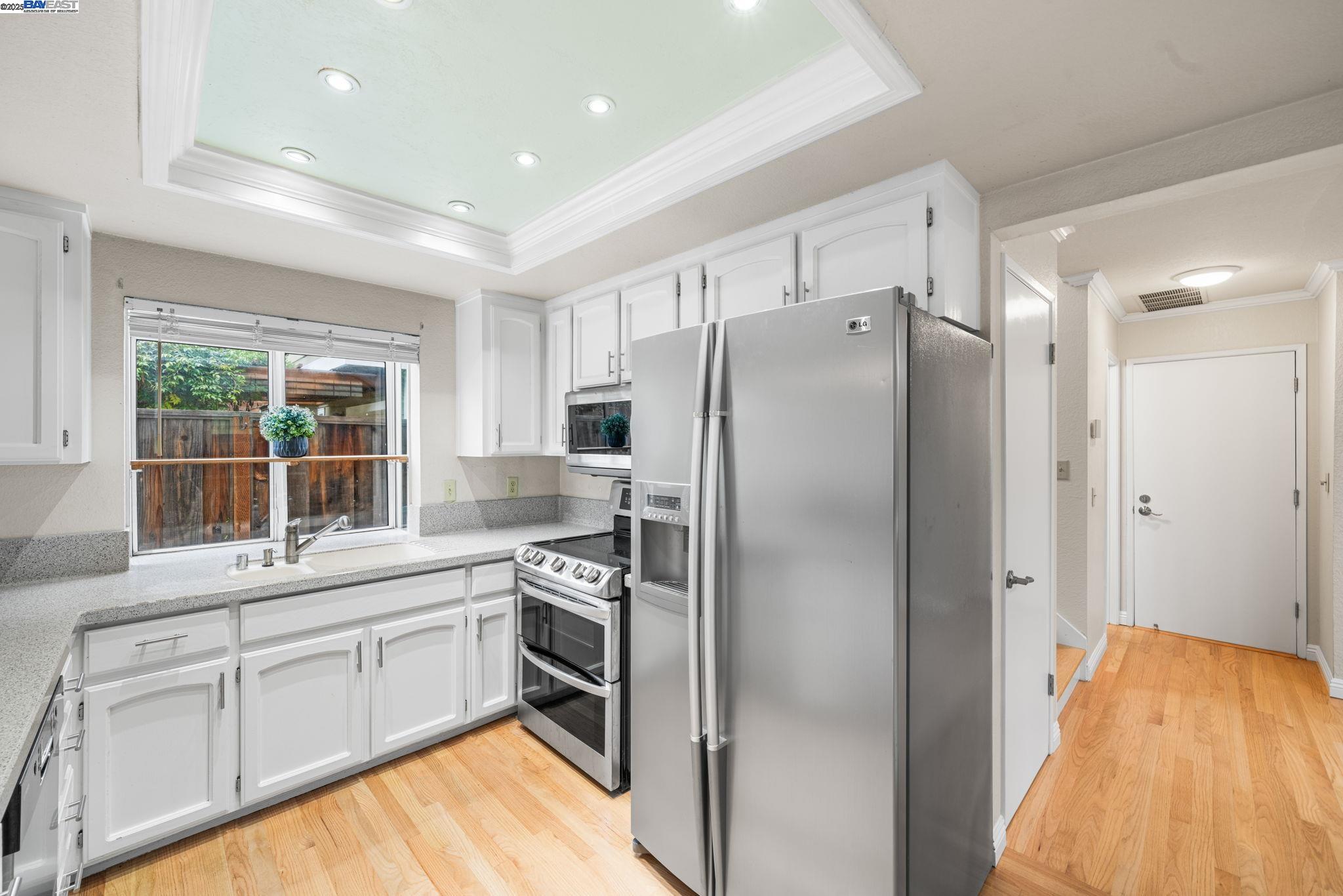 2864 El Capitan Drive Pleasanton, CA 94566 - Photo 10 of 45 a kitchen with a refrigerator sink and cabinets